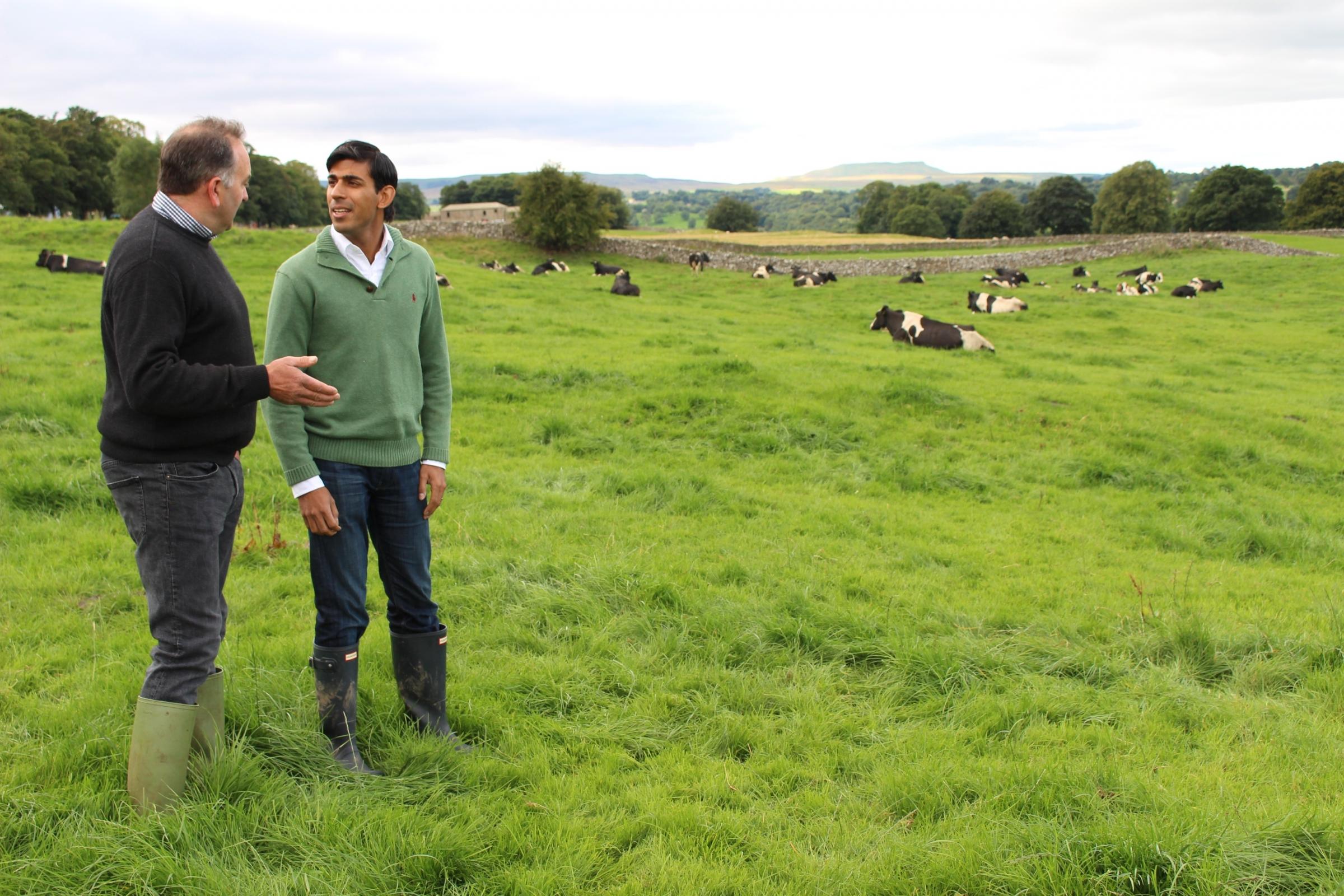 Rishi Sunak talking to tenant farmer James Dent, of West End Farm, Swinithwaite, Wensleydale, in his role as Richmond MP, in 2015