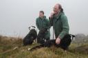 William and John Dawson at a misty Ingleborough summit. Picture Rob Fraser/somewhere-nowhere