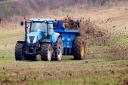 A farmer spreading fertiliser on a field in North Yorkshire