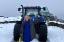 Ashleigh and the tractor that helped her continue with her job