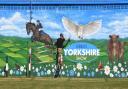 Artist Sam Porter at his new mural at the Great Yorkshire Showground Picture: GERARD BINKS