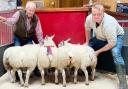 Rob Ellis, right, with the family’s latest prime lamb champions at Skipton, joined by show judge Mick Etherington