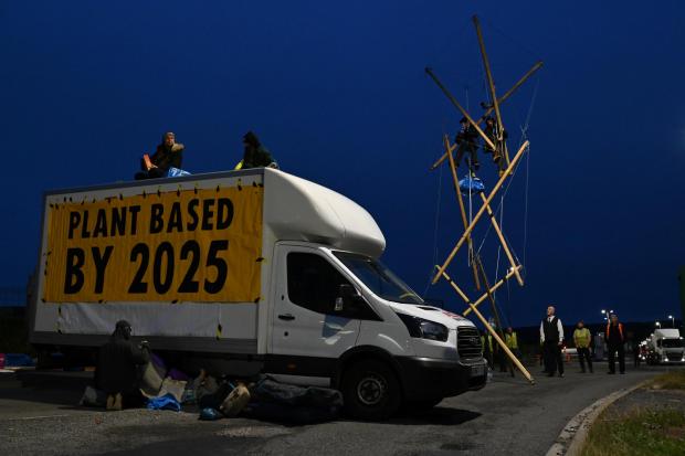 Animal Rebellion handout photo of their blockade of the Arla milk factory in Aylesbury, Buckinghamshire. The activists are calling on dairy company to transition to plant-based production by 2025 and claim they will not leave the firm's site until