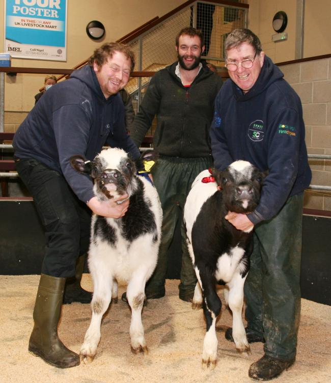 Paul Bolland, right, with his Skipton New Year calf show champion, joined by Alan Middleton and the reserve champion, and show judge Frankie Brown