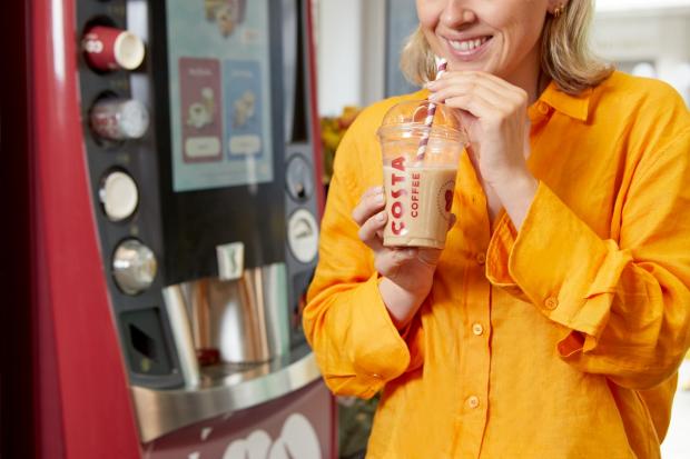 The Northern Farmer: A person holding a cold drink in front of a new Costa Express machine (Costa Coffee)