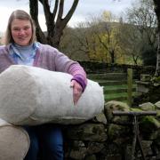 Ruth Lindsey with her prototype wool logs which are being used in a trial at Fleet Moss to try and preserve ancient peatland.