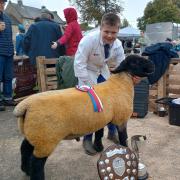John North with his Supreme Champion Suffolk tup lamb