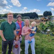 The Dickinson family, who own and operate the Brocksbushes business, at the development of a new and larger Brocksbushes Farm Shop and Café in 2023