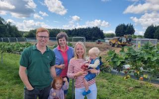 The Dickinson family, who own and operate the Brocksbushes business, at the development of a new and larger Brocksbushes Farm Shop and Café in 2023